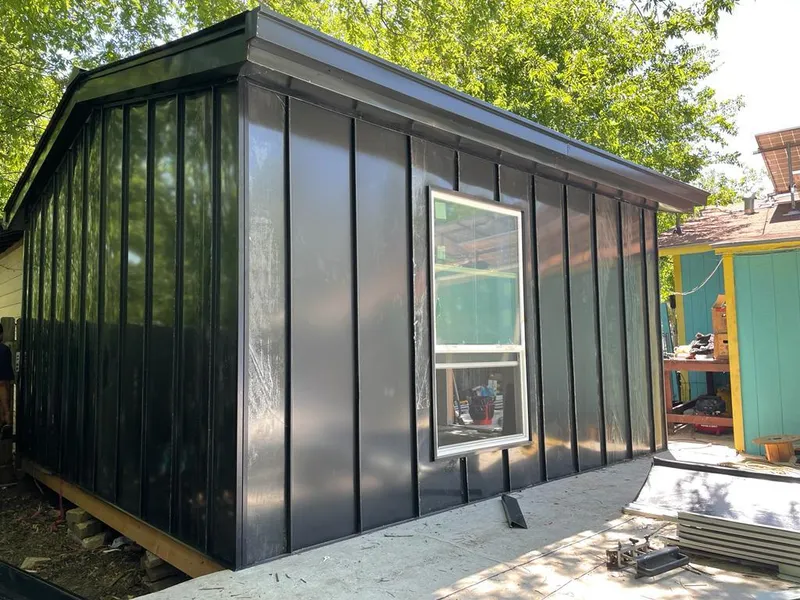 Black standing seam metal wall panels for Roof Inspection in Cambria