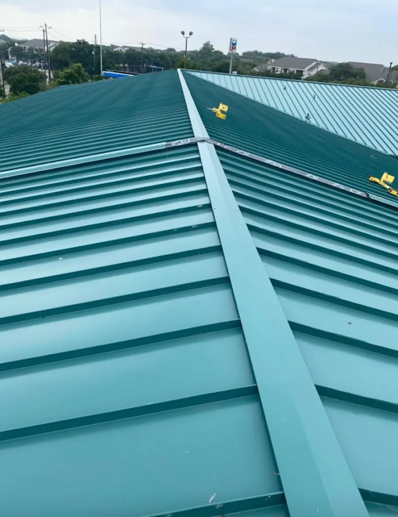 Green commercial metal roof ridge and valley for Metal Roof Repair in Cambria